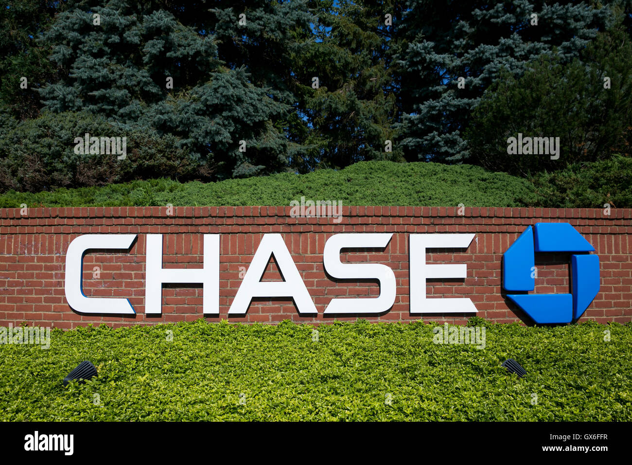 A logo sign outside of a facility occupied by Chase Bank in Columbus