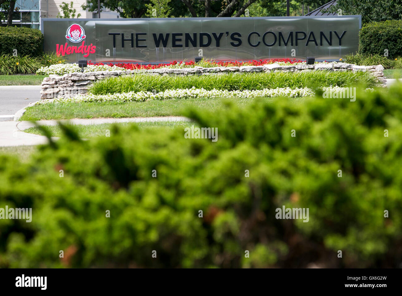 A logo sign outside of the headquarters of The Wendy's Company fast food restaurant chain in