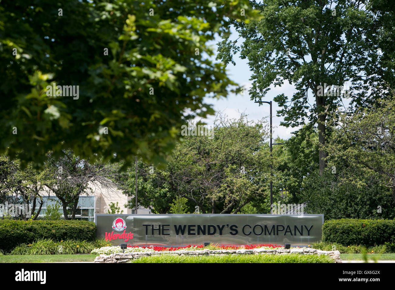 A logo sign outside of the headquarters of The Wendy's Company fast food restaurant chain in