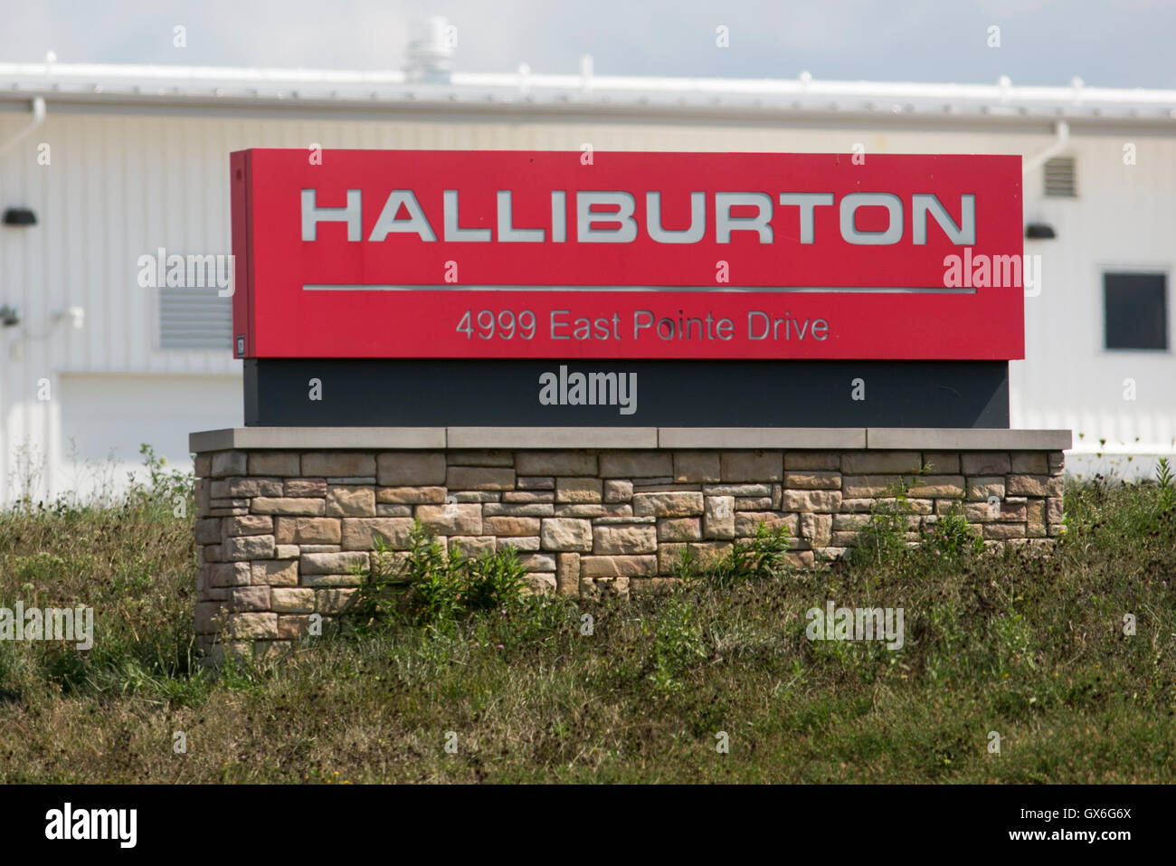 A logo sign outside of a facility occupied by the Halliburton Company