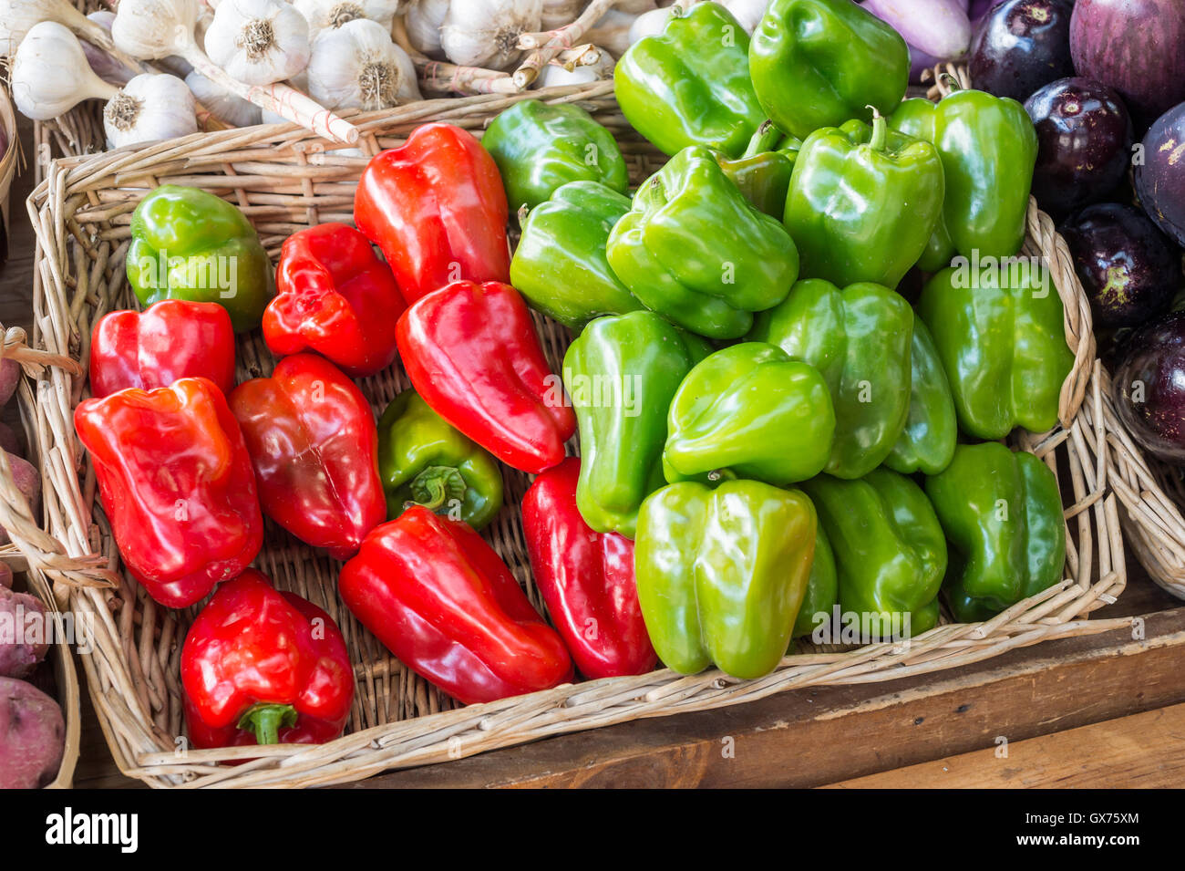 Red and green bell peppers at the market Stock Photo Alamy