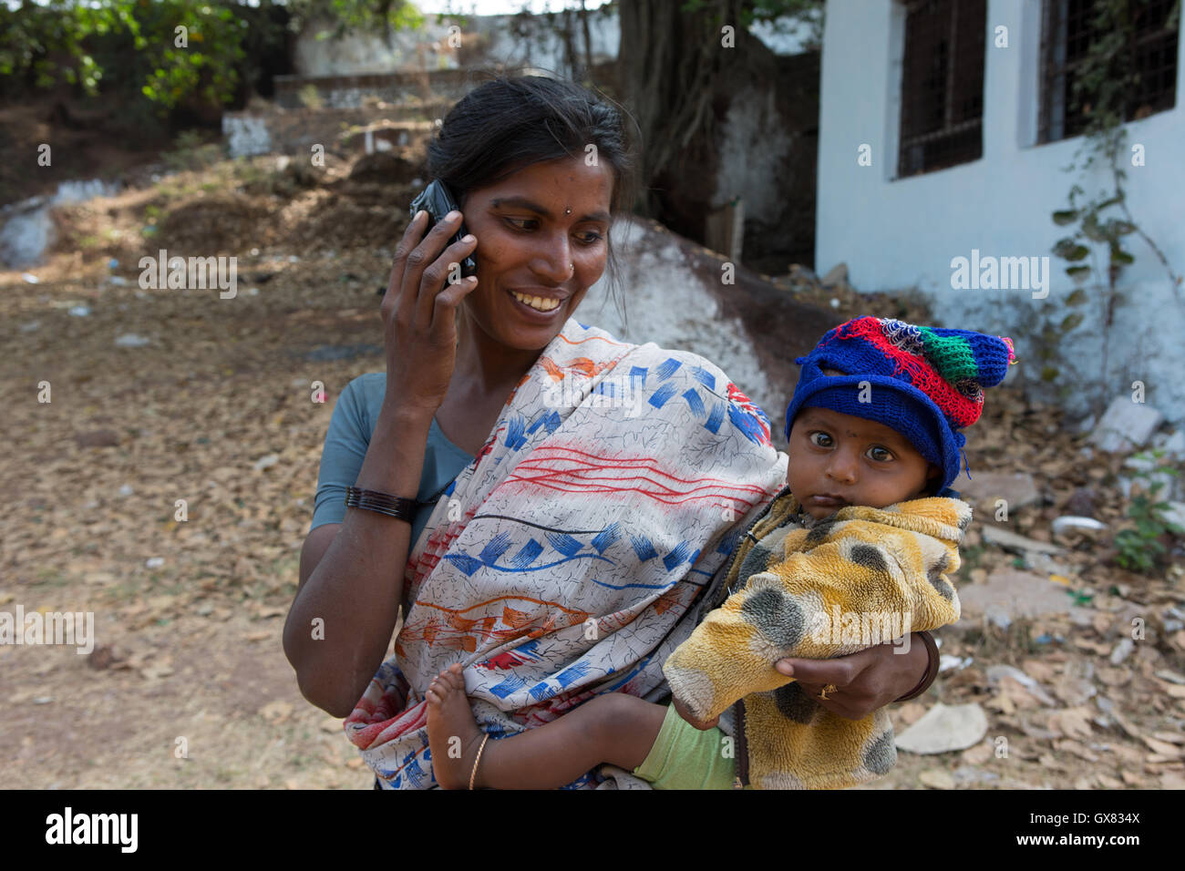 Indian woman holding baby hi-res stock photography and images - Alamy