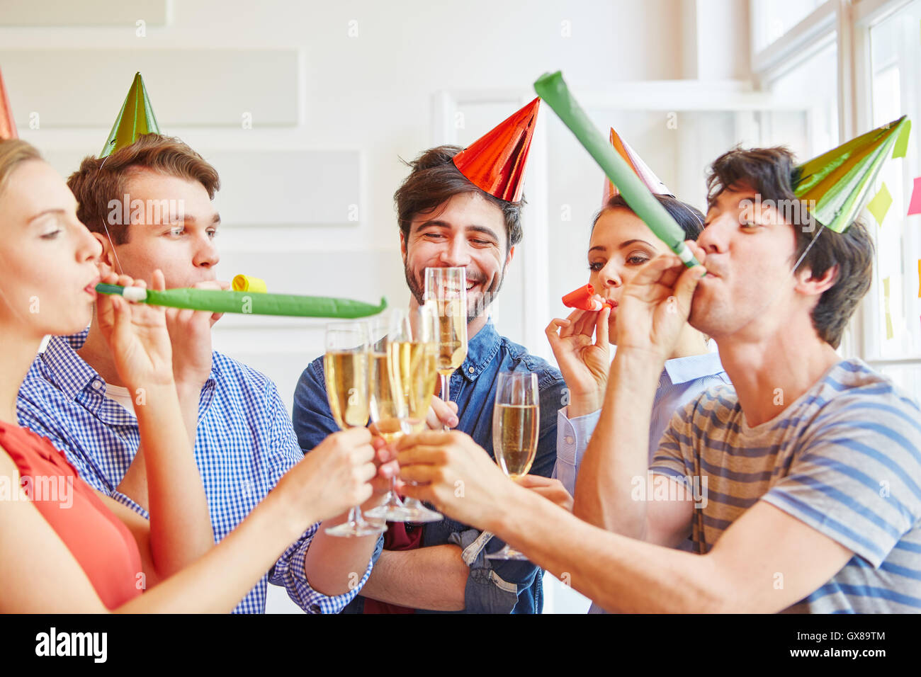 Students having fun at a party with sect Stock Photo
