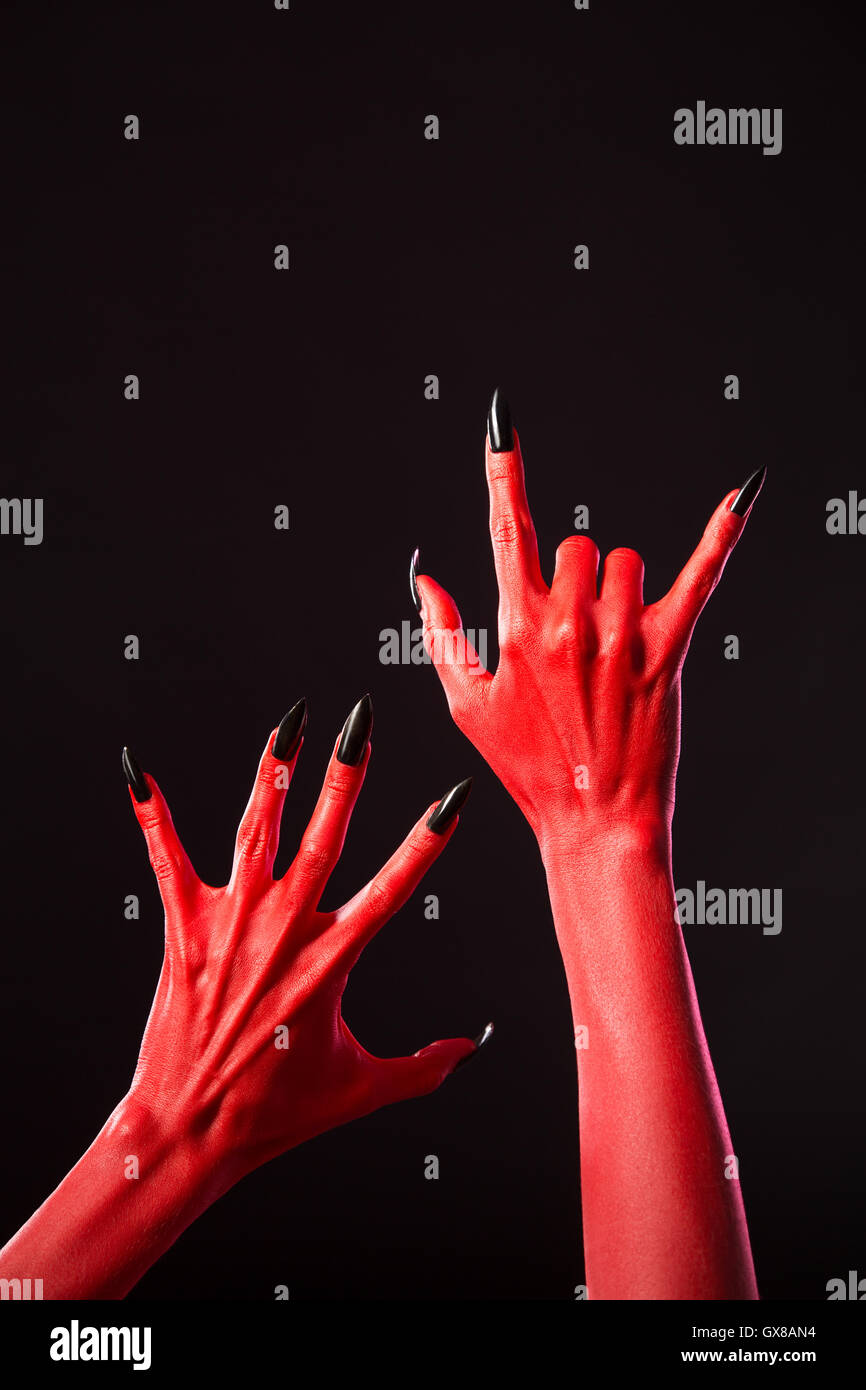 Red Devil Hands With Long Black Nails Real Body Art Stock Photo Alamy