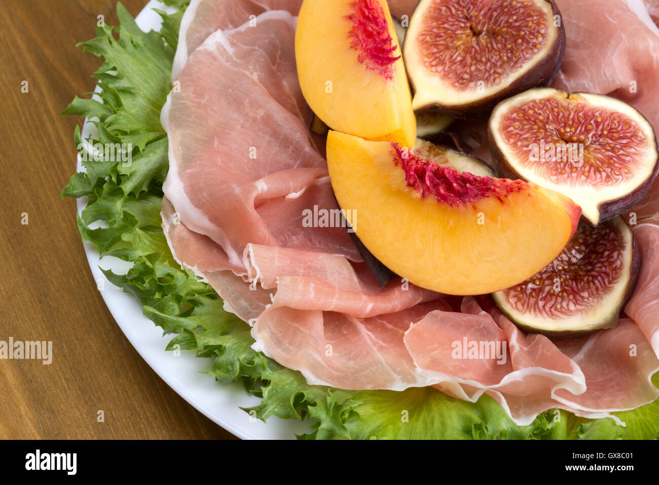 Prosciutto Traditional Italian drycured ham with figs and peaches