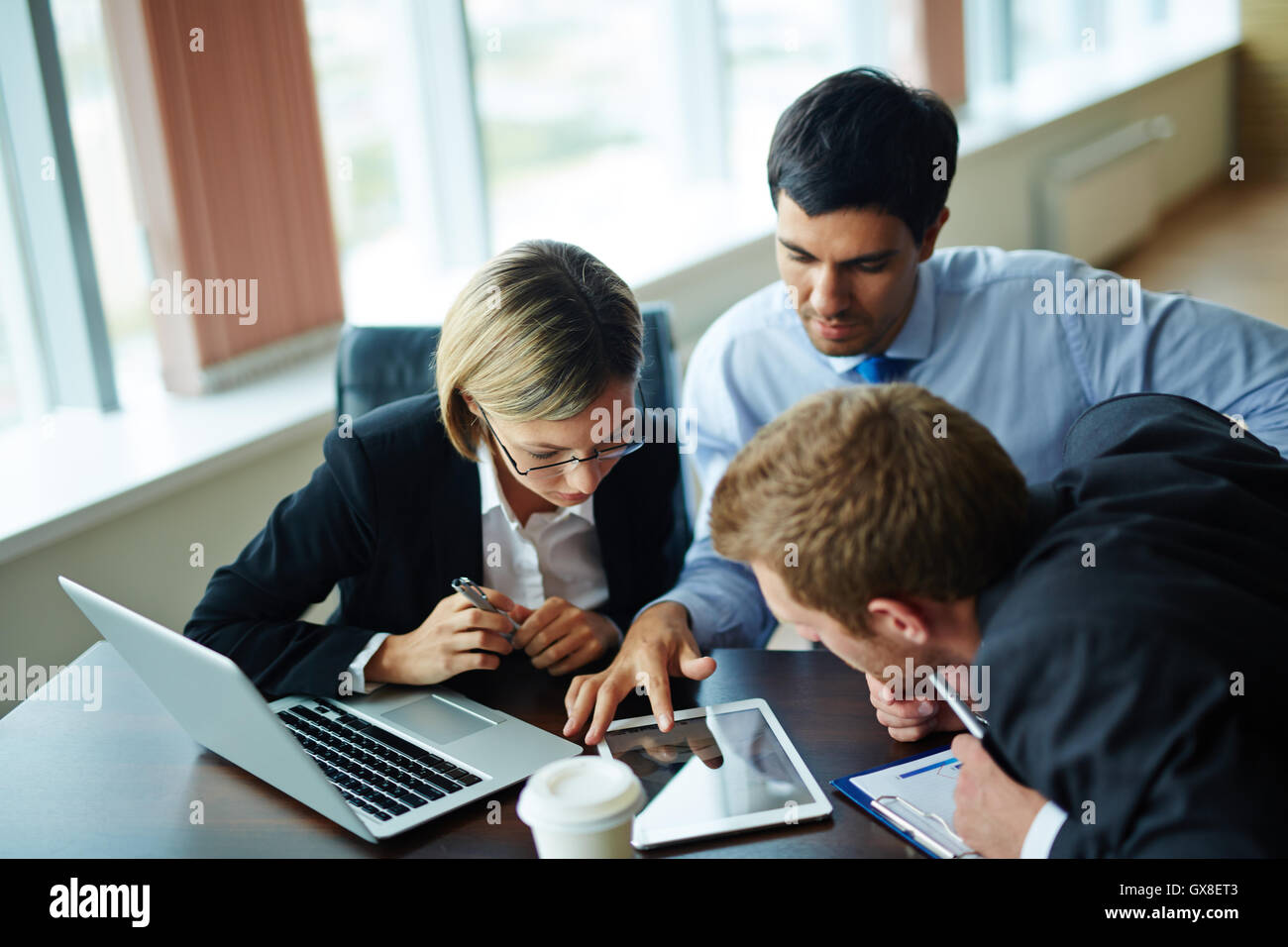 Using touchpad at meeting Stock Photo