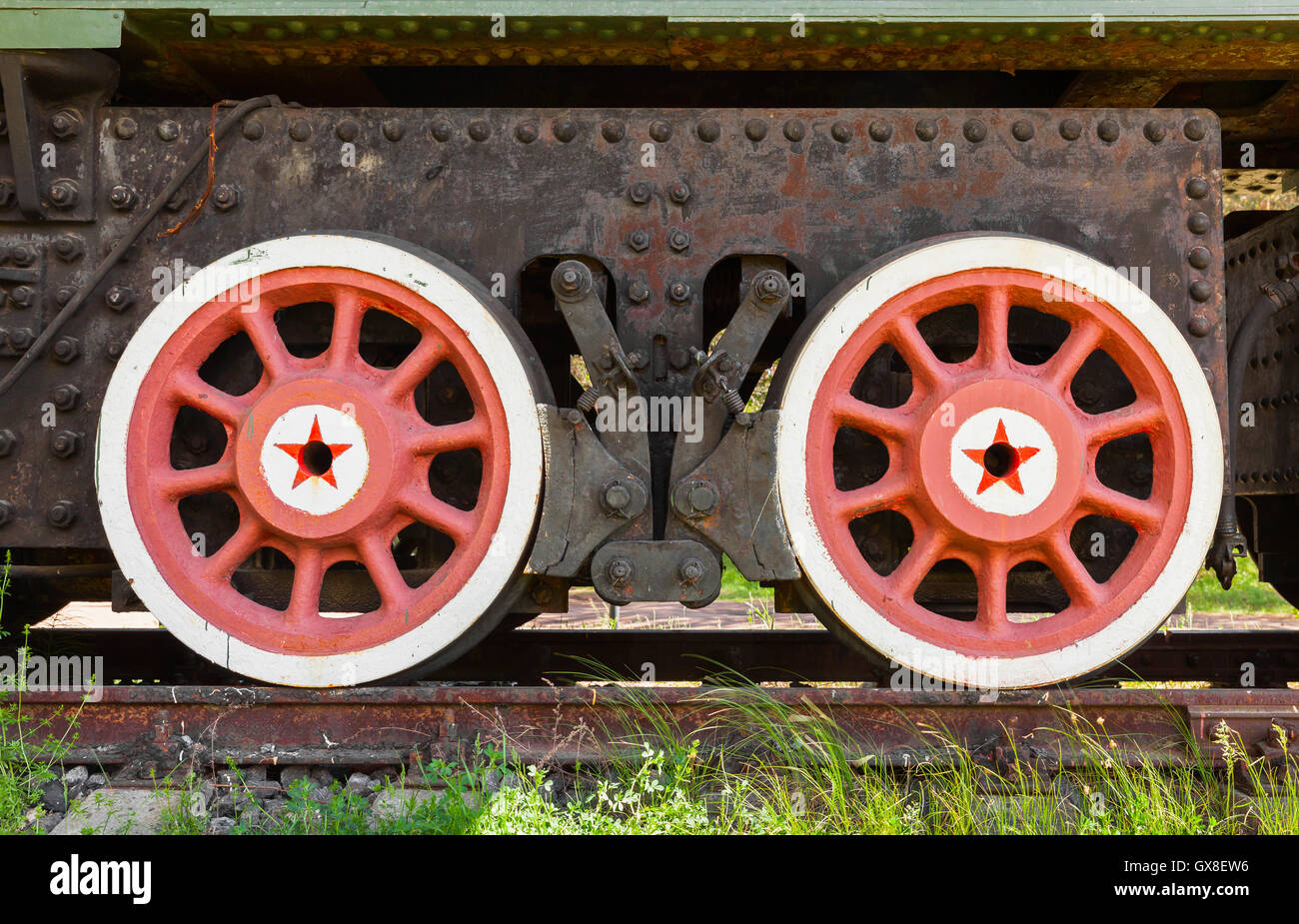 Red wheels with stars of railway gun system. Soviet railroad artillery system details Stock Photo