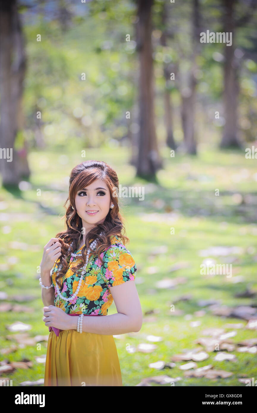 asia beautiful girl in the yellow dress on nature Stock Photo - Alamy