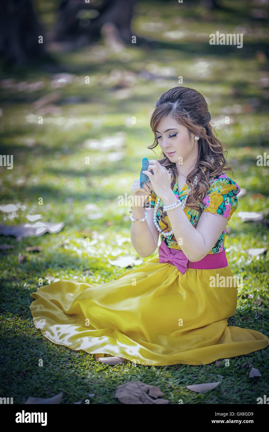 asia beautiful girl in the yellow dress on nature Stock Photo - Alamy