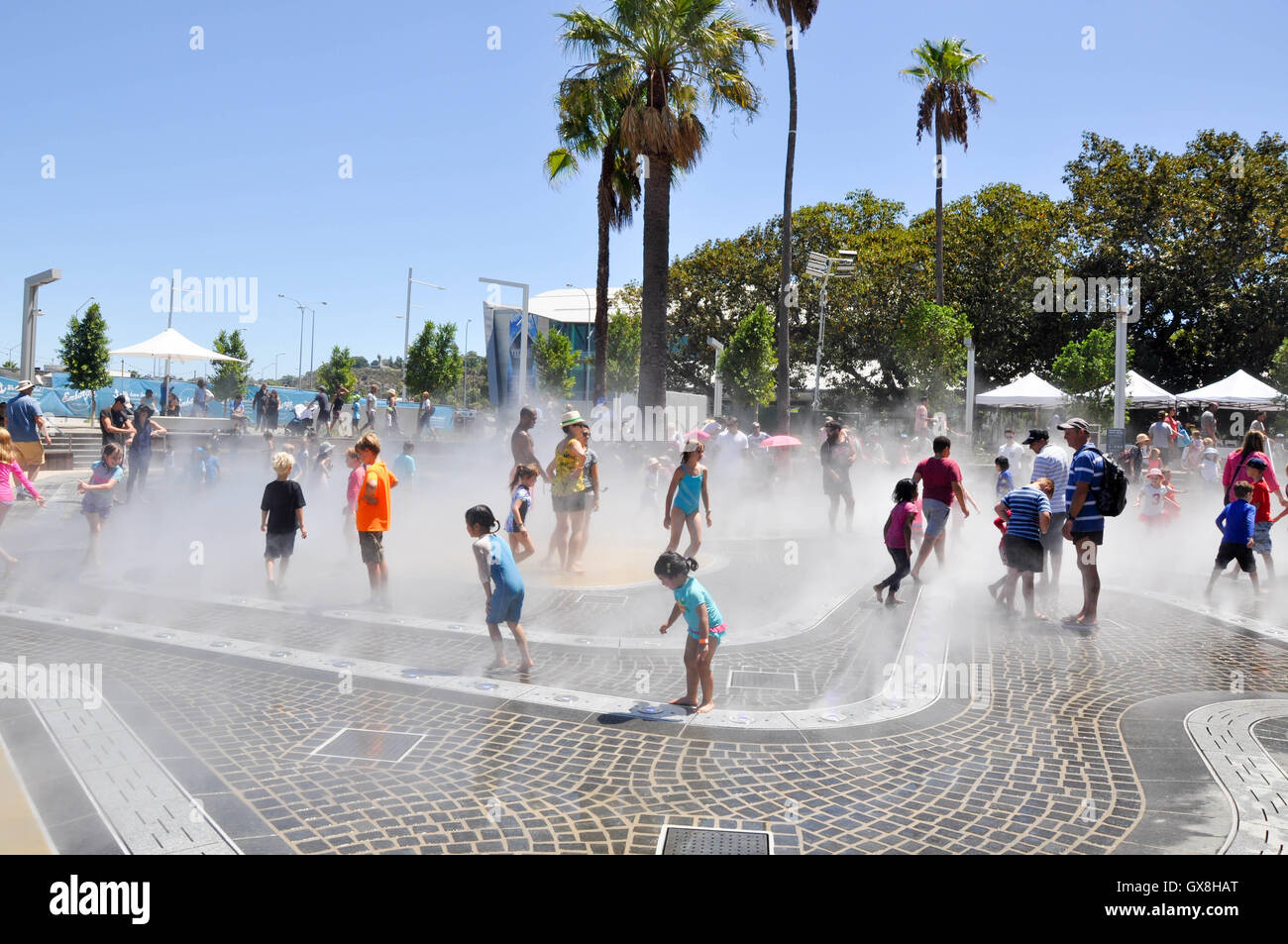 Perth,WA,AustraliaFebruary 13,2016 Interactive water park splash pad with families at the