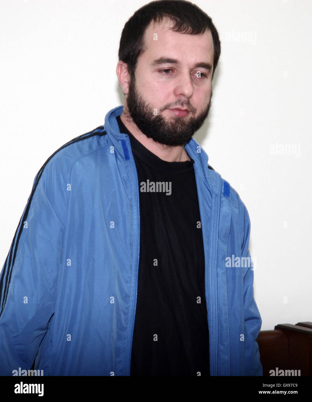 ISTANBUL - This file photo from June, 17, 2011, shows Chechen Akhmed Chatayev guarded in the town of Haskovo court by Bulgarian police officer after he has been arrested in Bulgaria after he tried to cross Bulgarian-Turkey border. A Chechen terrorist responsible for training Russian-speaking militants for ISIS is believed to be the planner of Tuesday's deadly Istanbul airport massacre that killed 43, according to Turkish media.  Akhmed Chatayev was identified on a UN sanctions list as an ISIS leader and was wanted by Russian authorities, Reuters reported citing the pro-government Yeni Safak ne Stock Photo