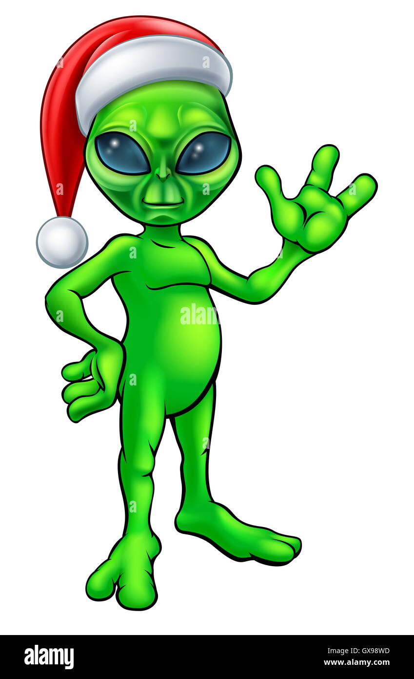 A little Christmas green man alien in a Santa hat cartoon character waving Stock Photo