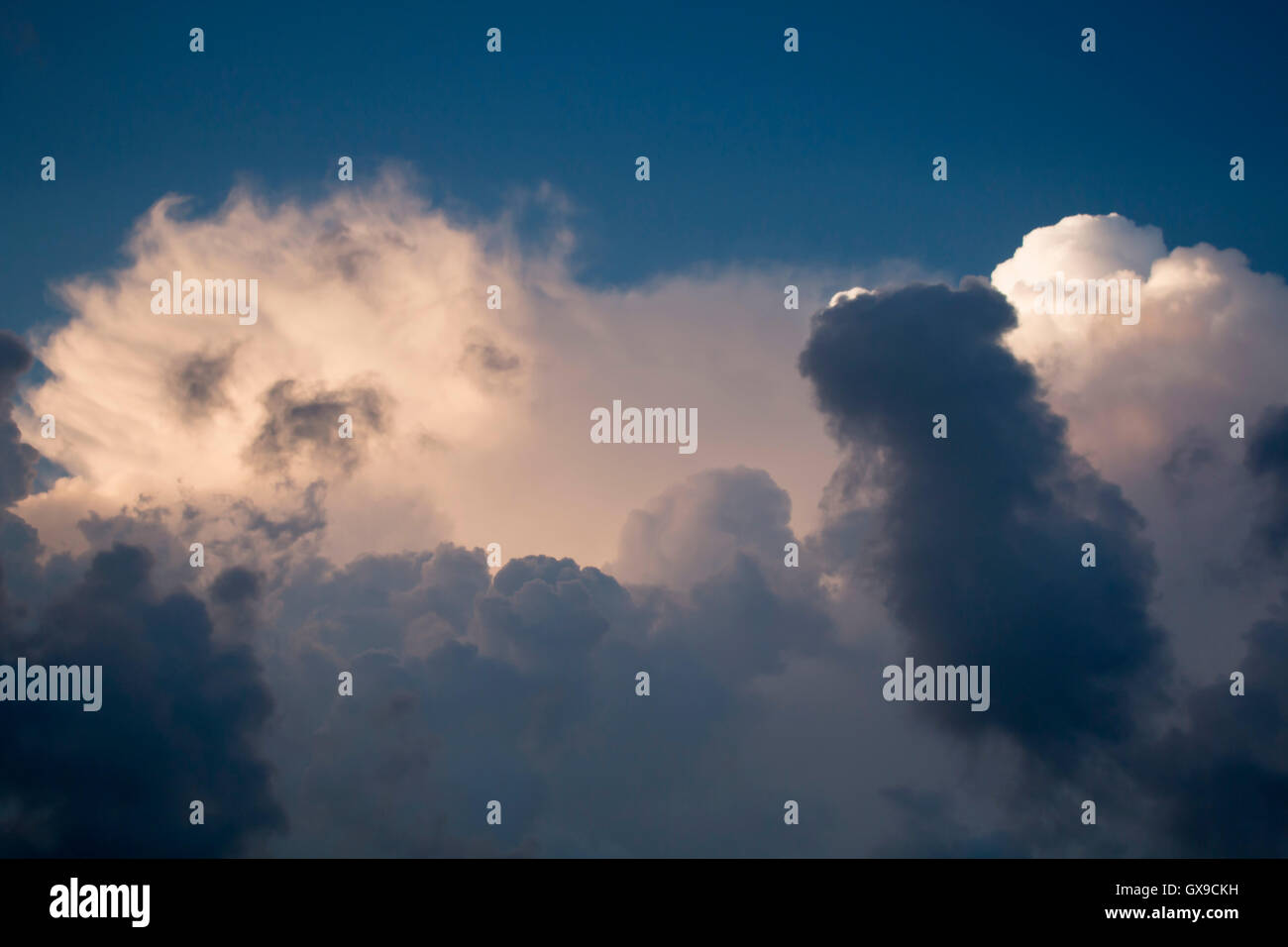 Thundercloud on a background of blue sky. Stock Photo
