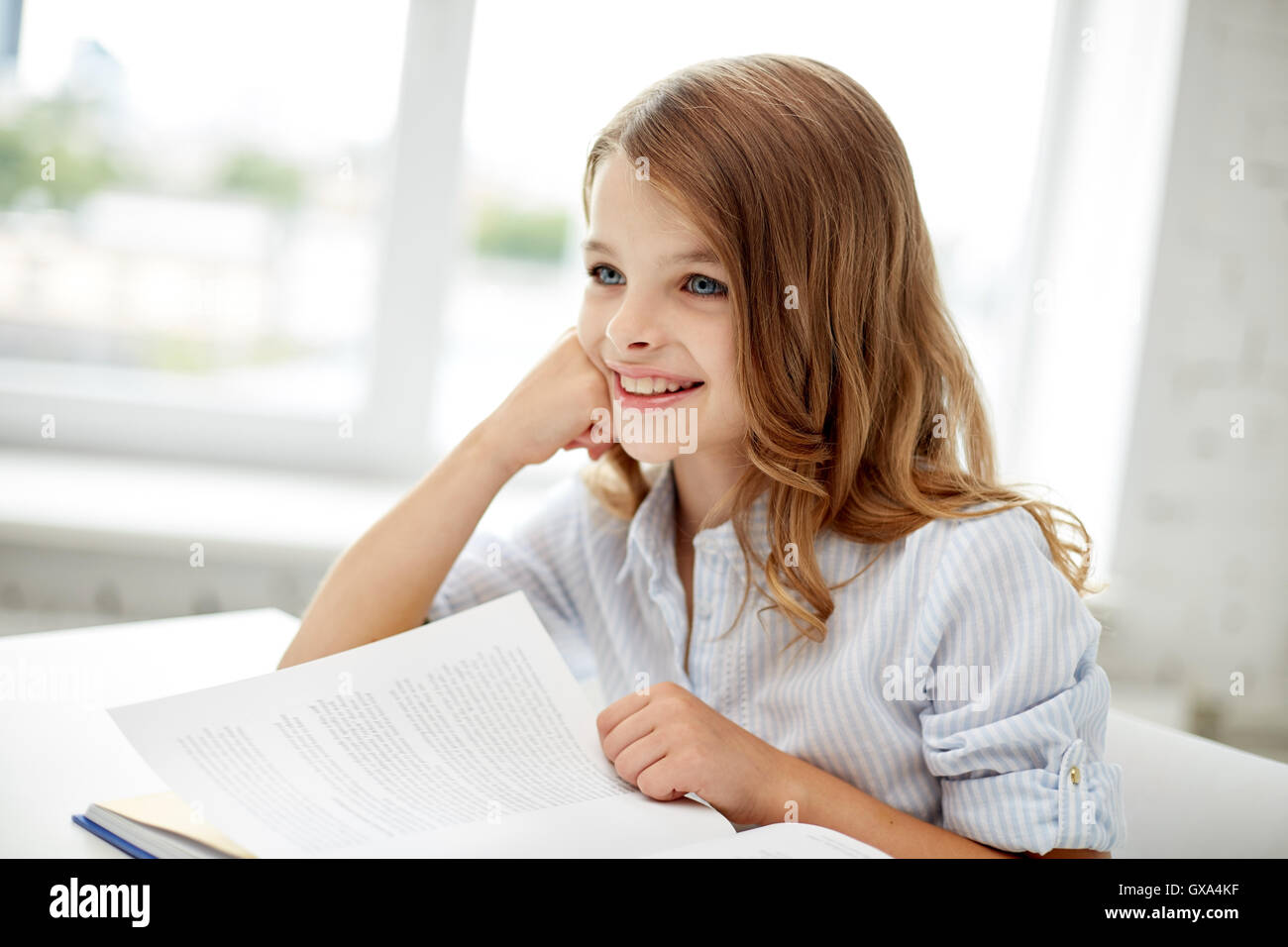 happy student girl reading book at school Stock Photo - Alamy