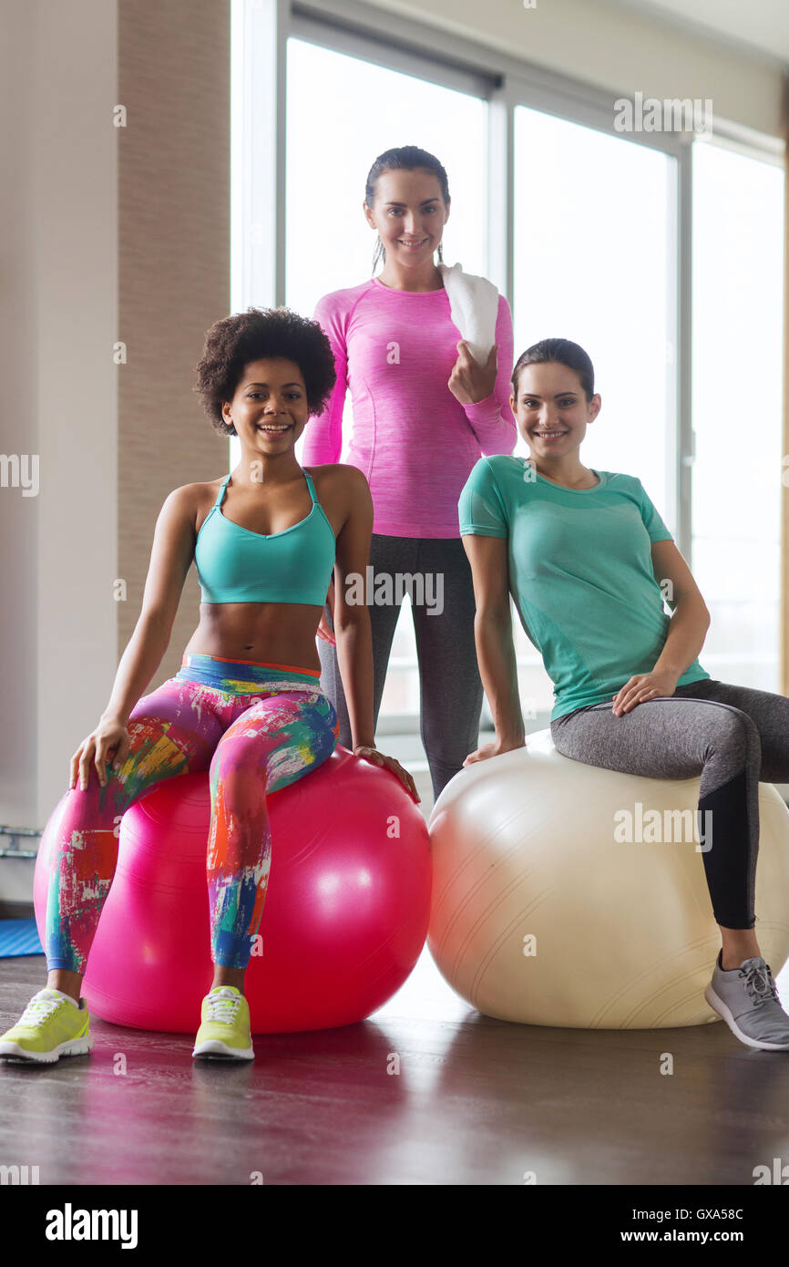 group of smiling women with exercise balls in gym Stock Photo - Alamy