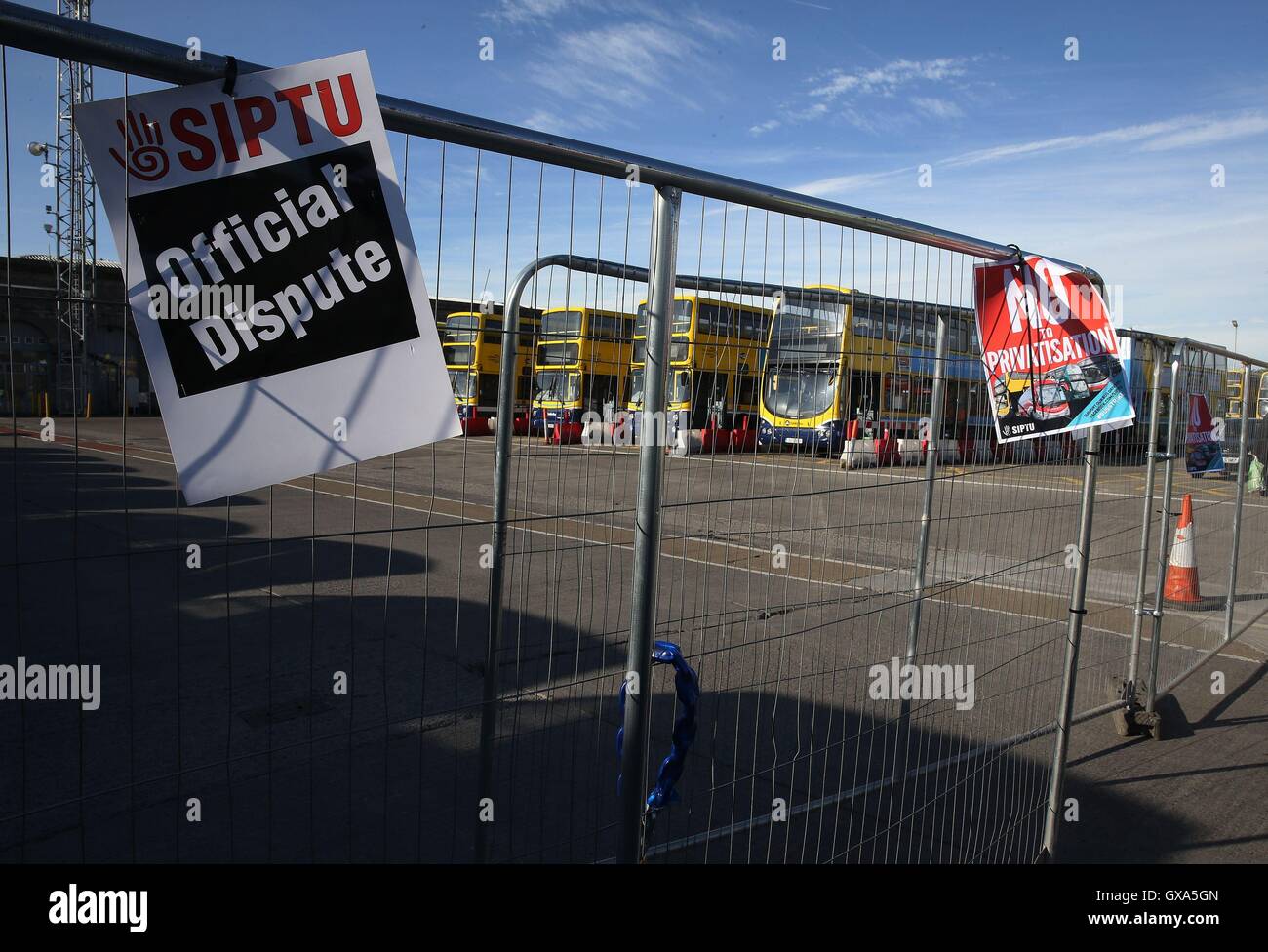 Buses sit idle at the Broadstone Bus depot in Dublin as commuters are