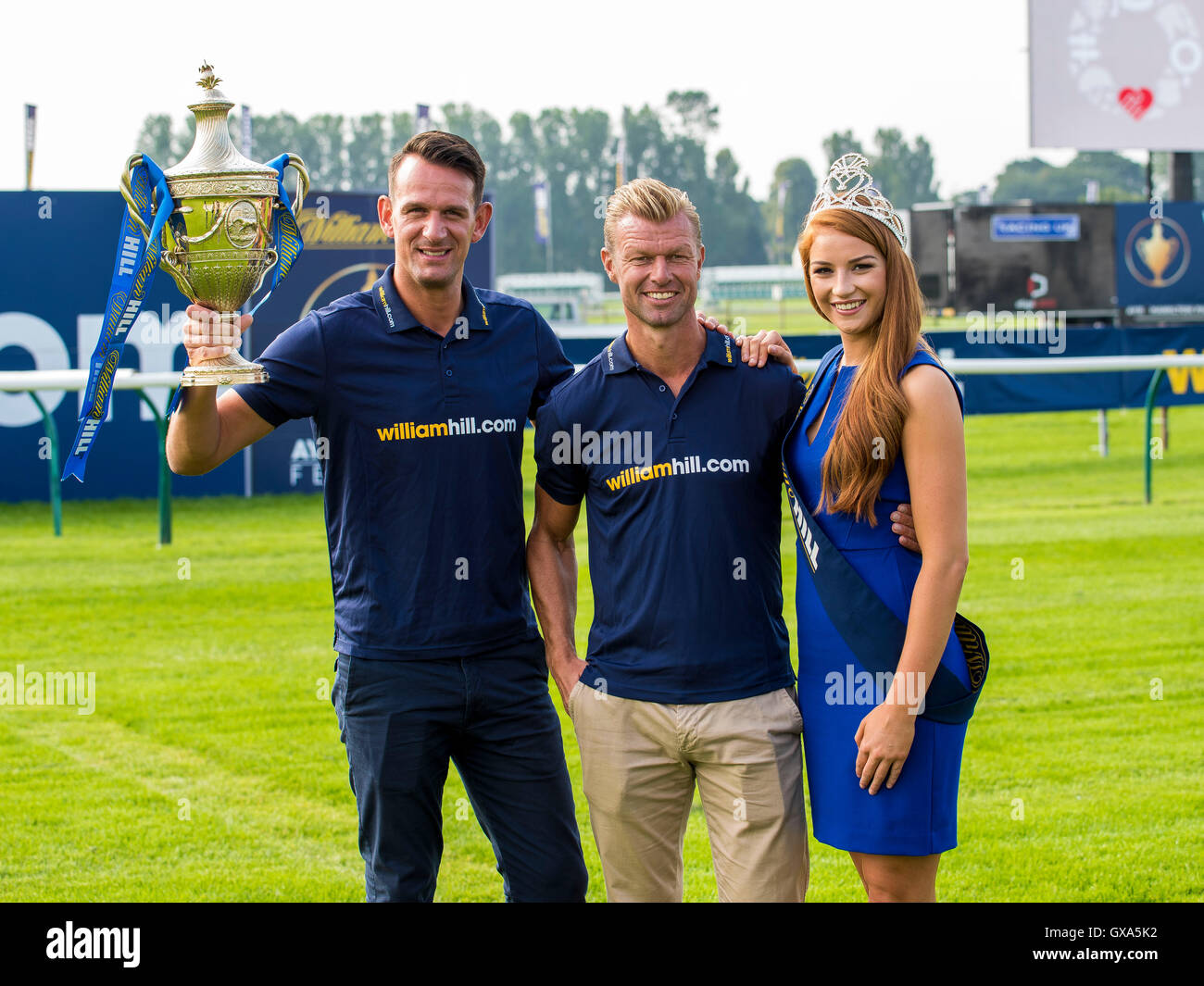 Miss Scotland Lucy Kerr with Old Firm players Jan Vennegoor of Hesselink (left) and Arthur Numan during day one of the 2016 William Hill Ayr Gold Cup Festival at Ayr Racecourse. PRESS ASSOCIATION Photo. Picture date:  Thursday September 15, 2016. See PA story RACING Ayr. Photo credit should read: Craig Watson/PA Wire. Stock Photo