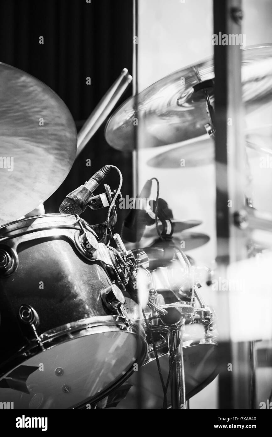 Vertical rock music photo background, drummer plays on cymbals, black and white Stock Photo