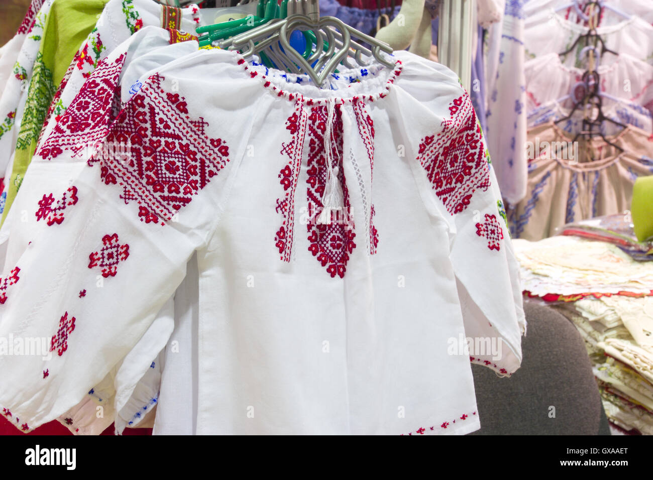 Handmade traditional national russian clothes with embroidery and ornaments. Shot was done at the flea market in Moscow (Russia) Stock Photo