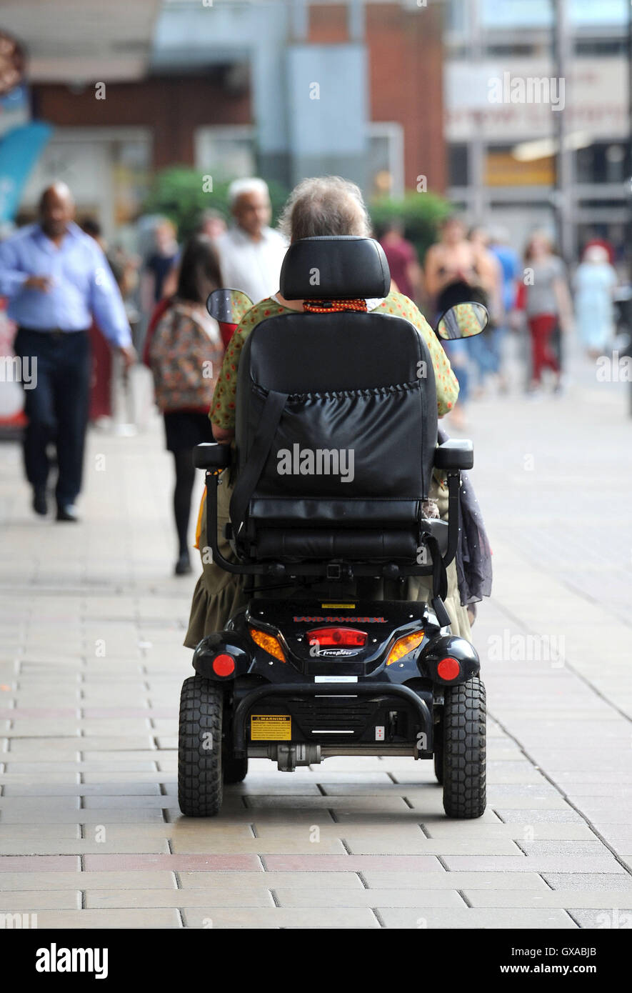 General view of a woman using a disability scooter in Broad Walk