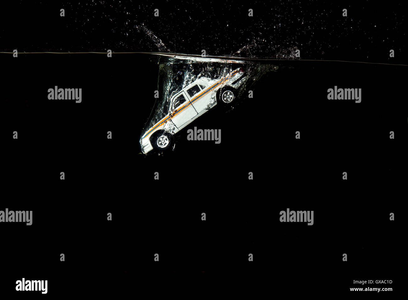 passenger car fell into the water holding up a lot of splashing night