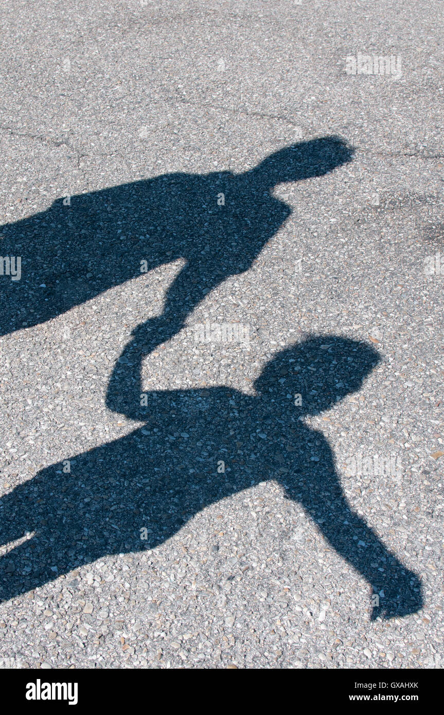shadows of man and boy Stock Photo