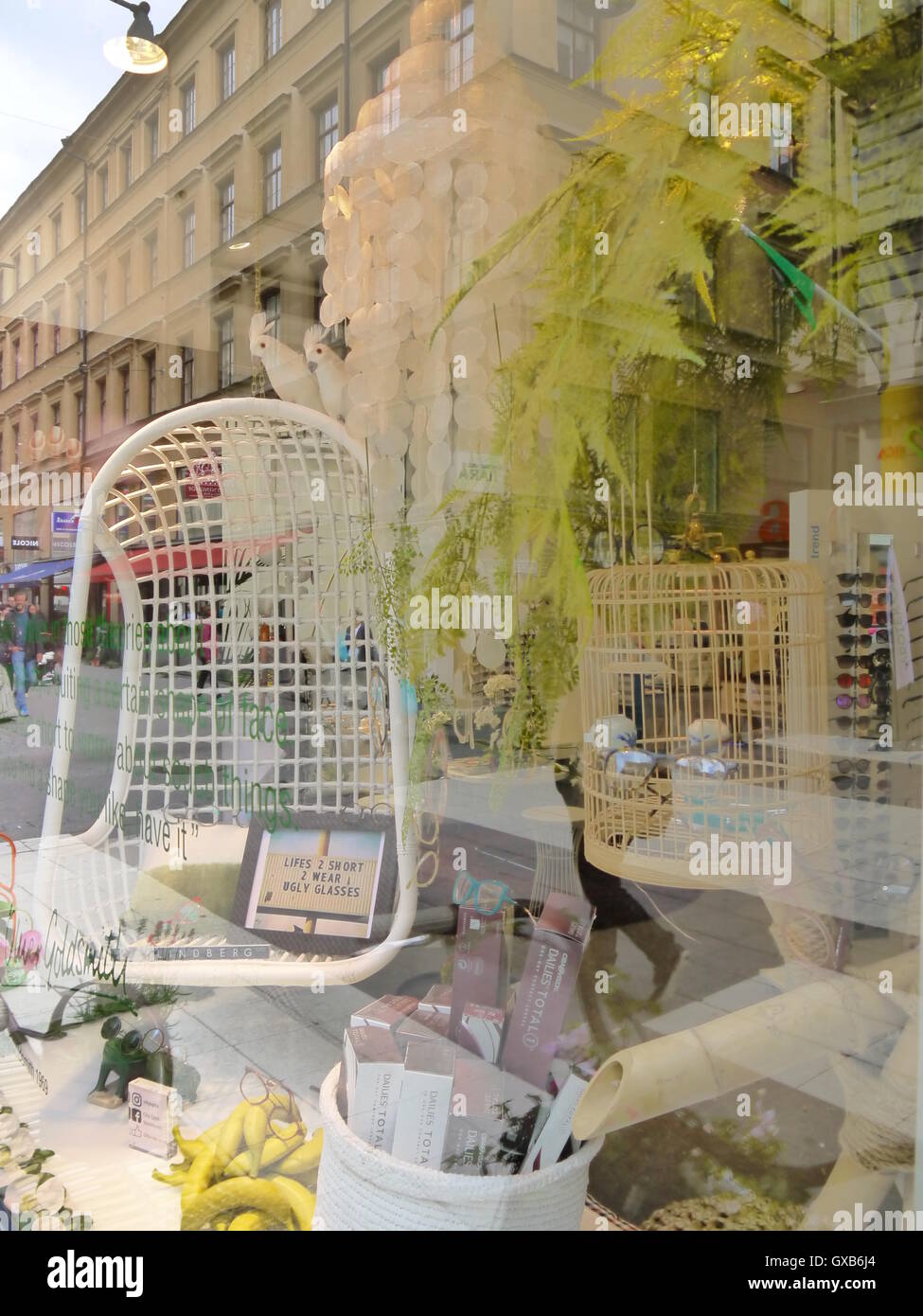 Romantic reflection in shop window, in the biggest shopping street, Stockholm, Sweden, Europe Stock Photo