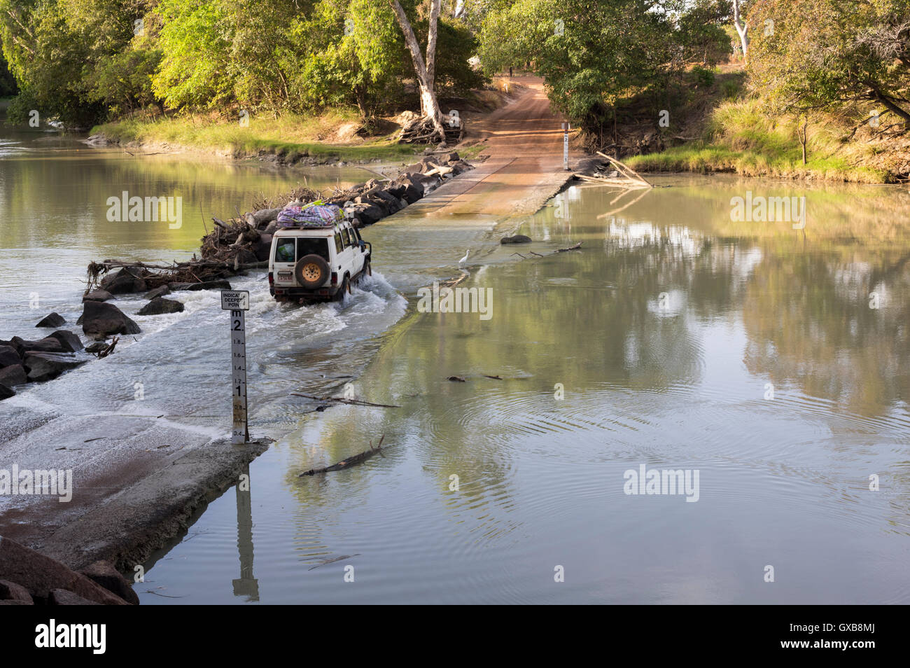 A 4WD vehicle fording the East Alligator River into Arnhem Land at