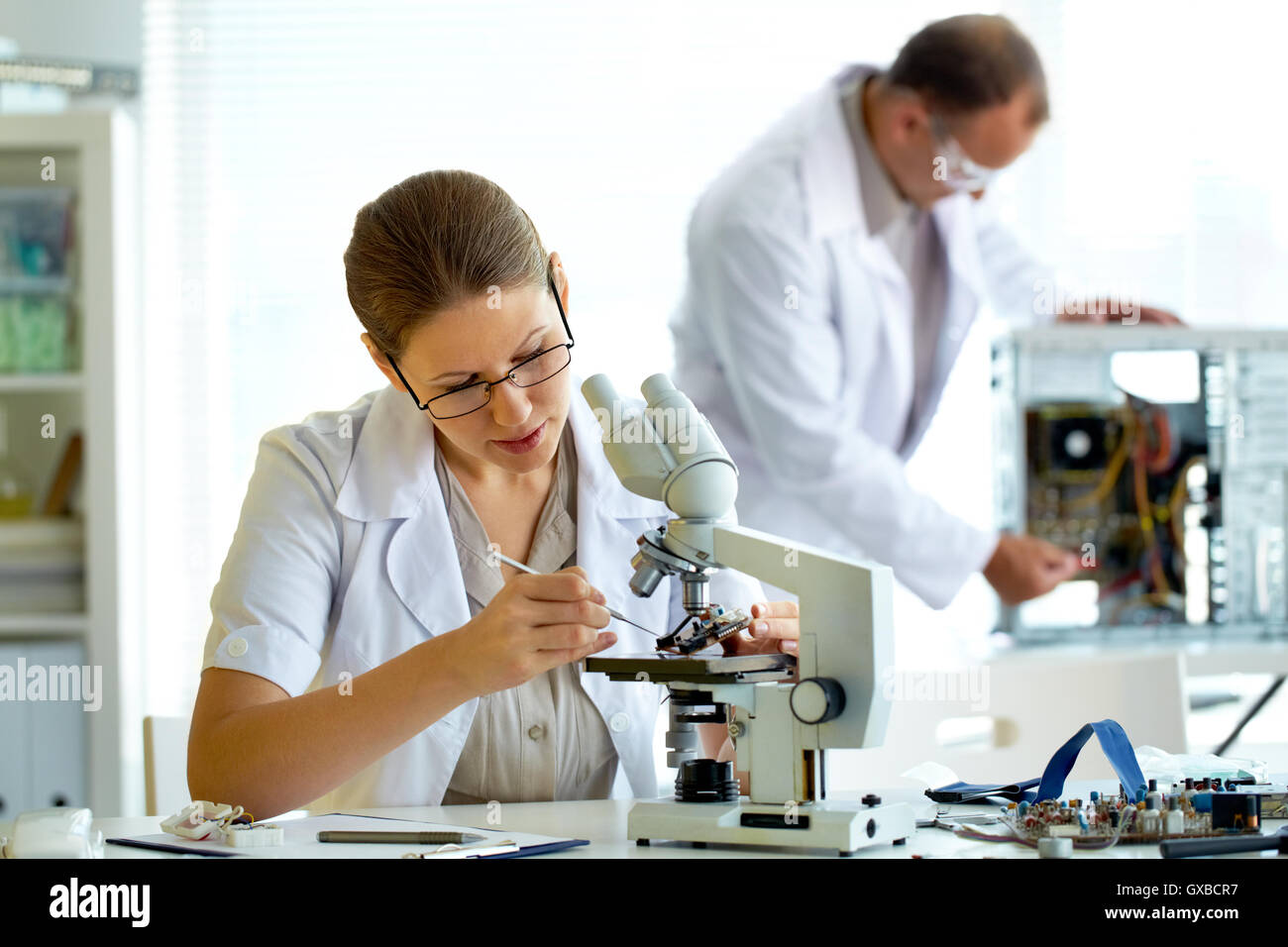 Pair of technicians in workshop Stock Photo