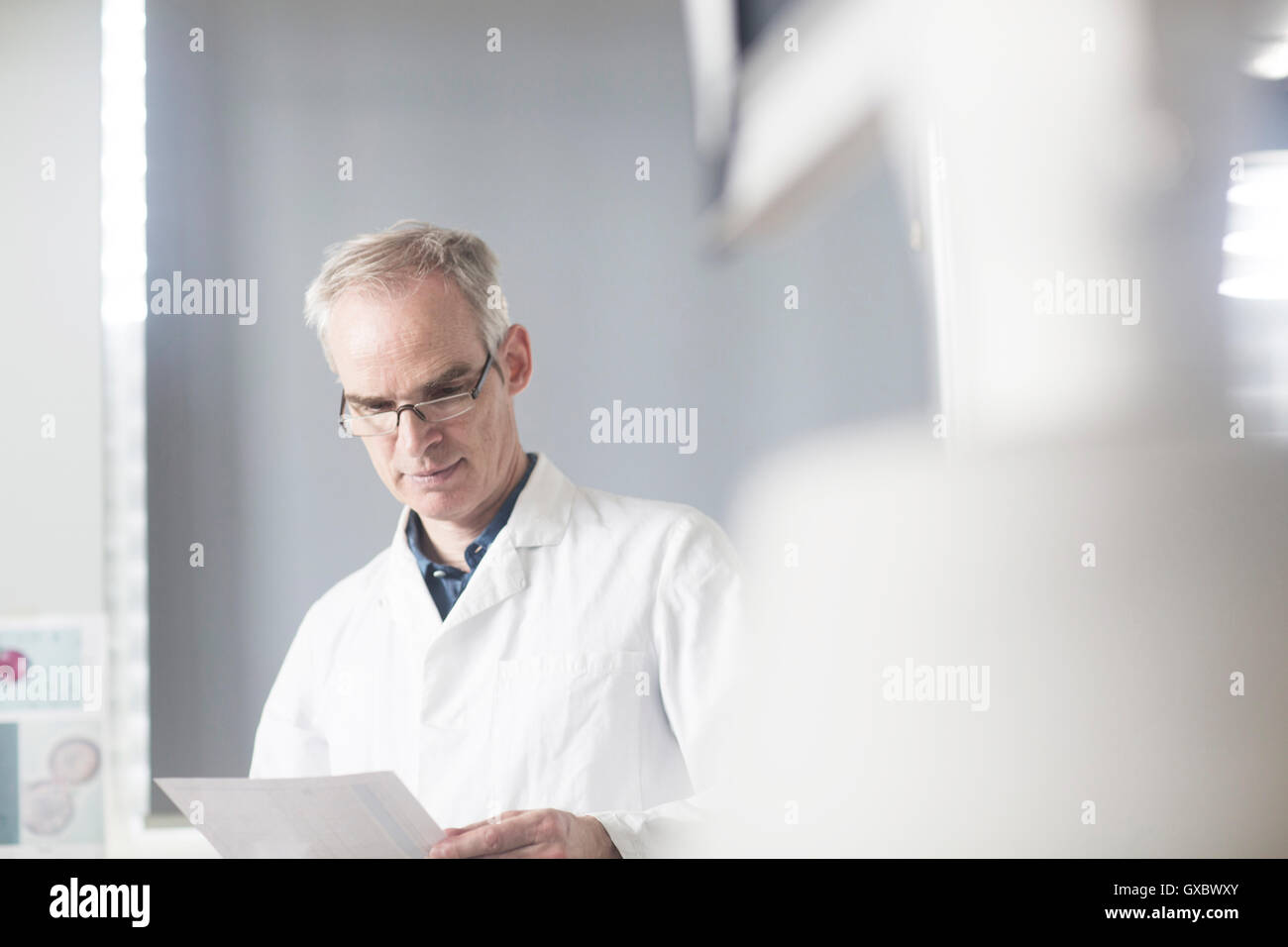 Meteorologists Male Male meteorologist reading data in weather station laboratory Stock ...