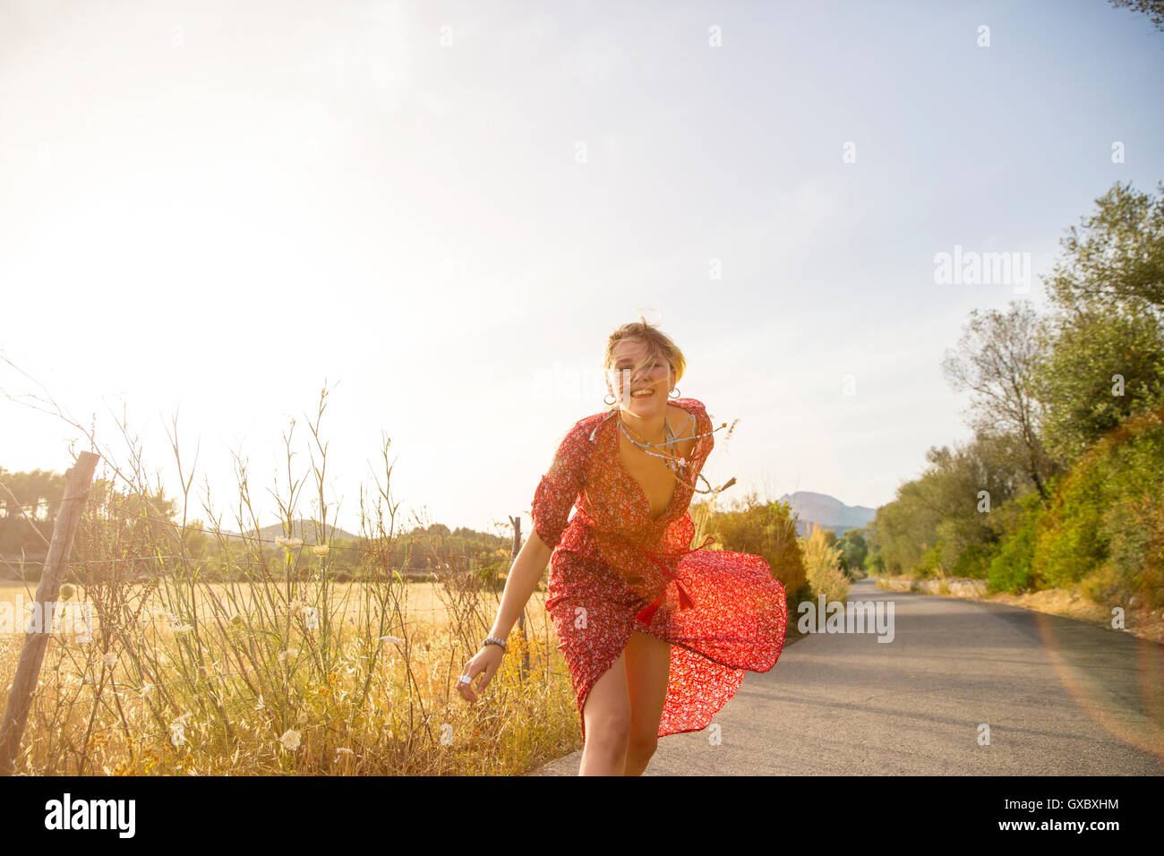 Woman running away dress hi-res stock photography and images - Alamy