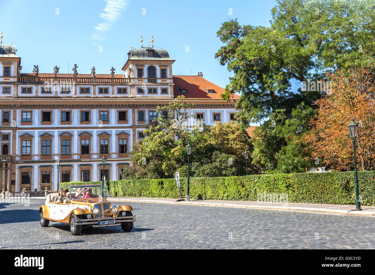 Popular sightseeing tour in a vintage convertible car, Hradčany Square, Castle district, Prague 1, Czech Republic. Stock Photo