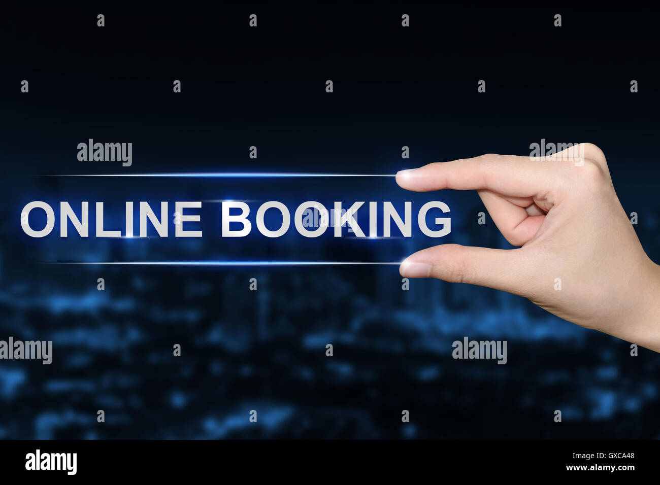 hand pushing online booking button on blurred blue background Stock Photo