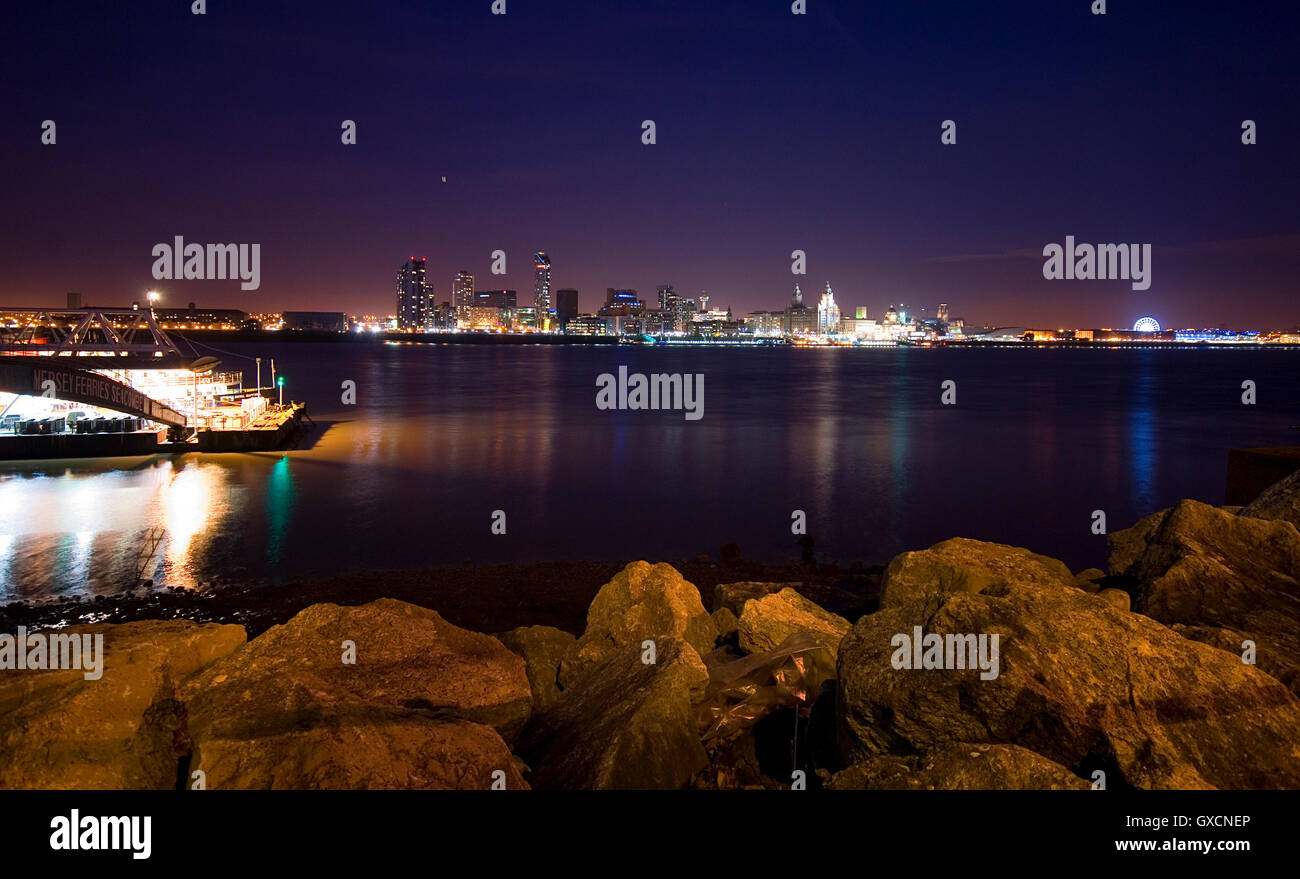 Liverpool skyline at night taken from Birkenhead on the Wirral, UK Stock Photo