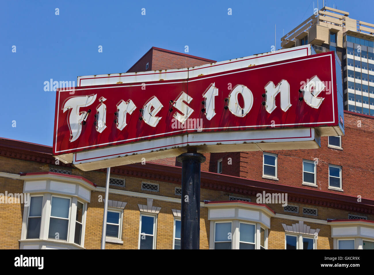 Indianapolis - Circa June 2016: Firestone Complete Auto Care Location with Legacy Neon Sign I Stock Photo