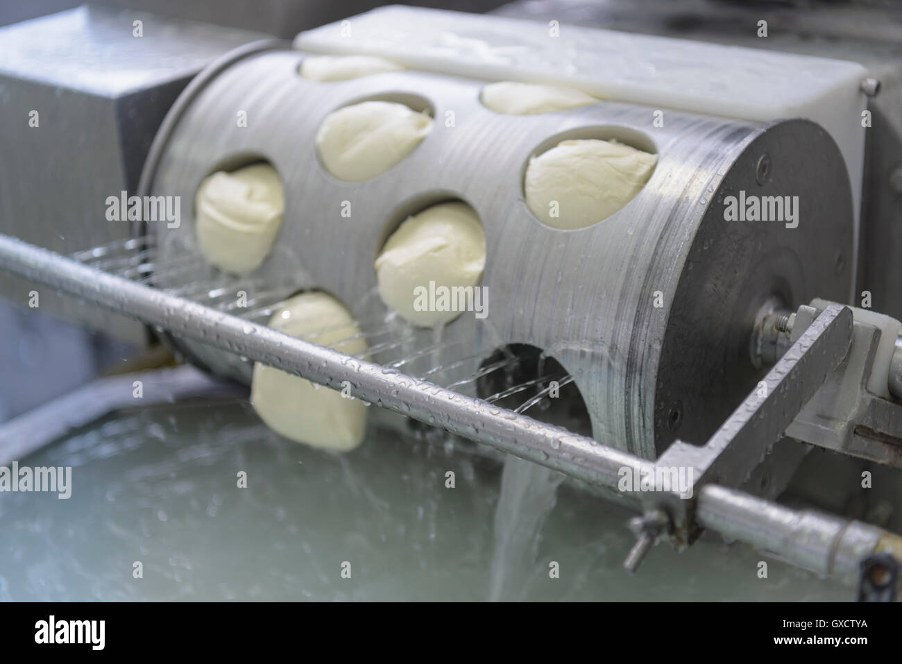 Detail of mozzarella-forming machine operated in cheese ...