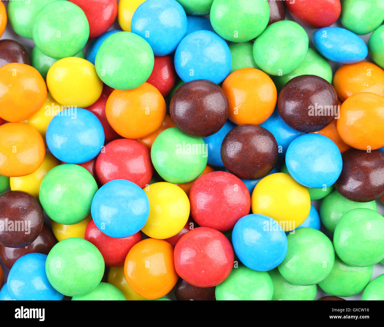 Chocolate drops with bright colored candy coating Stock Photo Alamy