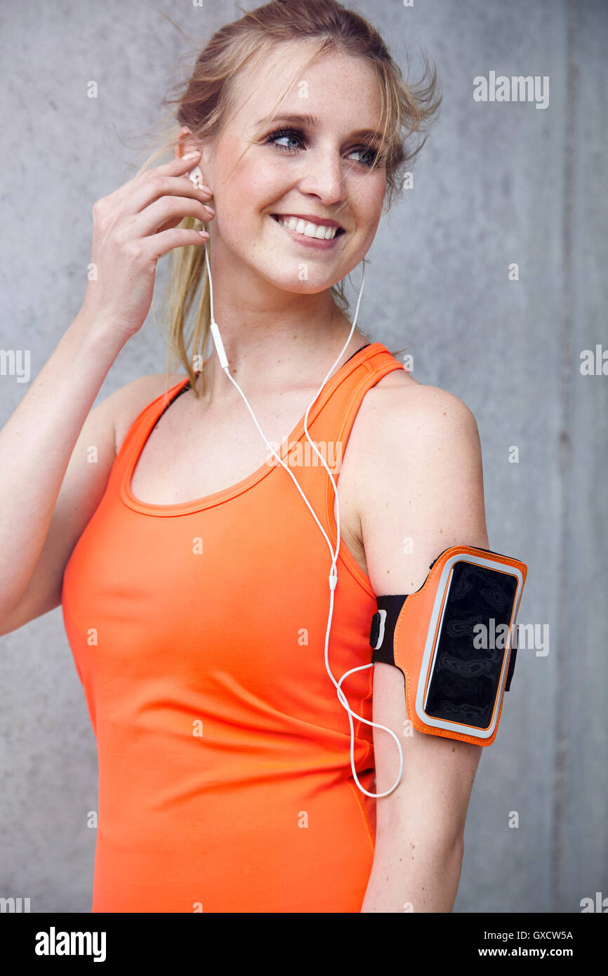 Woman with wearable technology and headphones Stock Photo