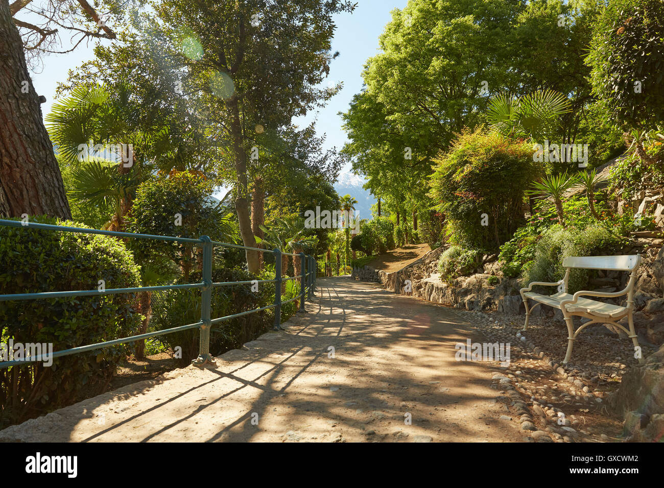 Empty bench on rural pathway, Meran, South Tyrol, Italy Stock Photo
