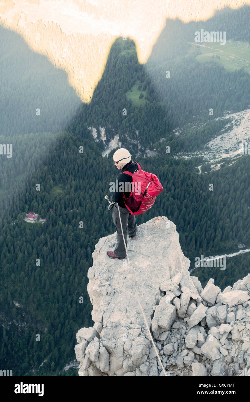 BASE jumper checking the exit spot at Torre Trieste, Italian Alps, Alleghe, Belluno, Italy Stock Photo