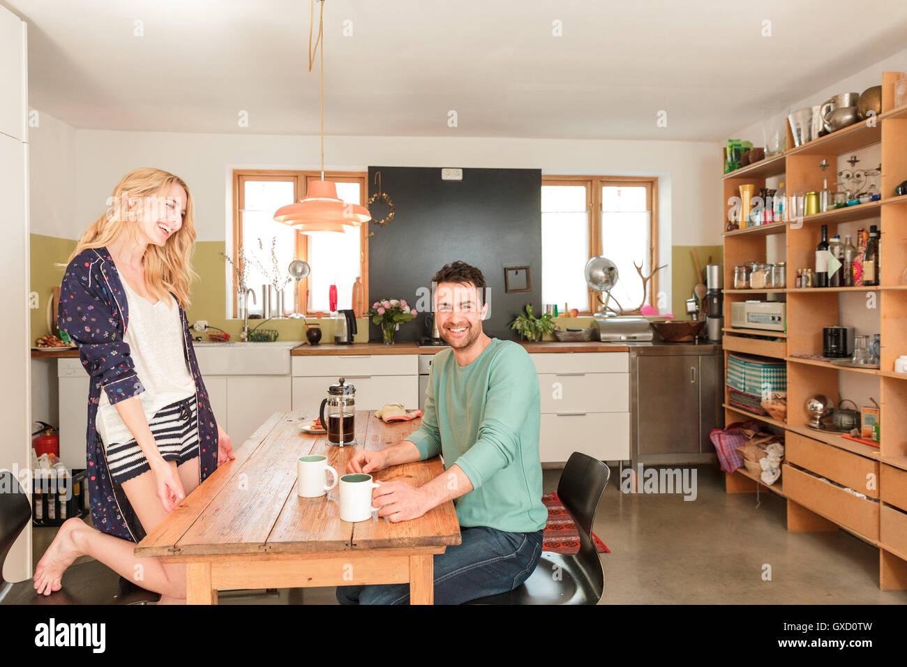 Couple at dining table having coffee Stock Photo