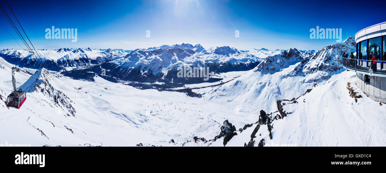 Panoramic view of ski lift in snow covered mountains, Sankt Moritz, Engadin, Switzerland Stock Photo