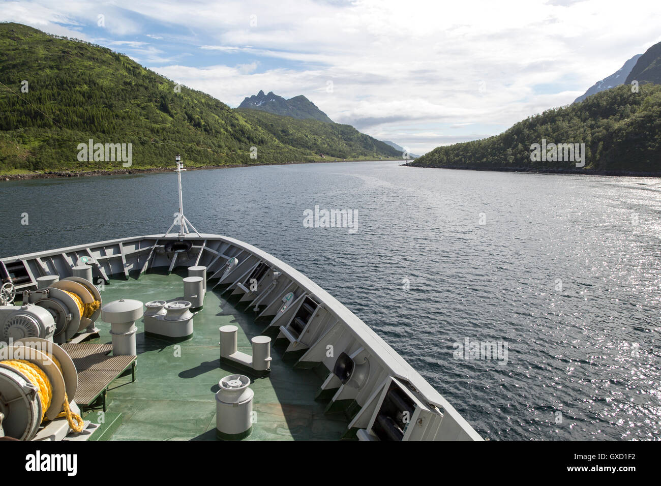 Hurtigruten ferry ship passing down fjord Raftsundet, Hinnoya Island, Nordland, northern Norway Stock Photo