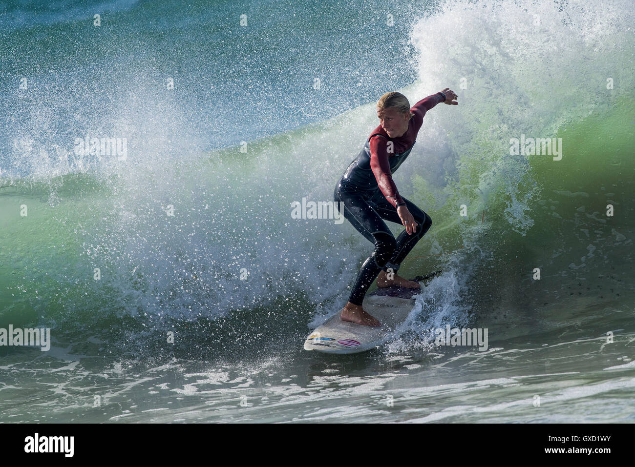 A surfer in spectacular action at Fistral in Newquay, Cornwall, England. Stock Photo