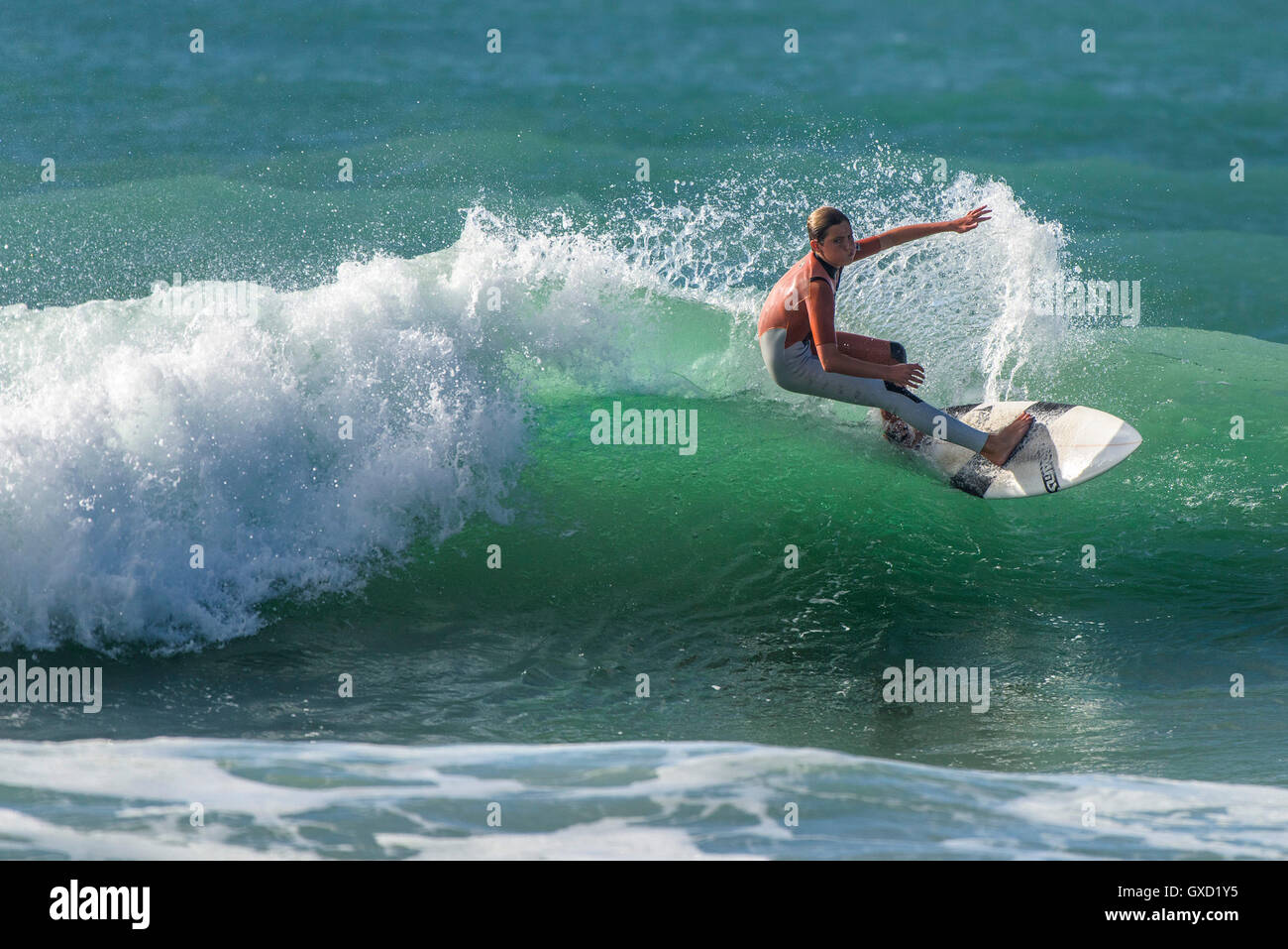 A young Finn Collins in spectacular surfing action at Fistral in Newquay, Cornwall. UK. Stock Photo