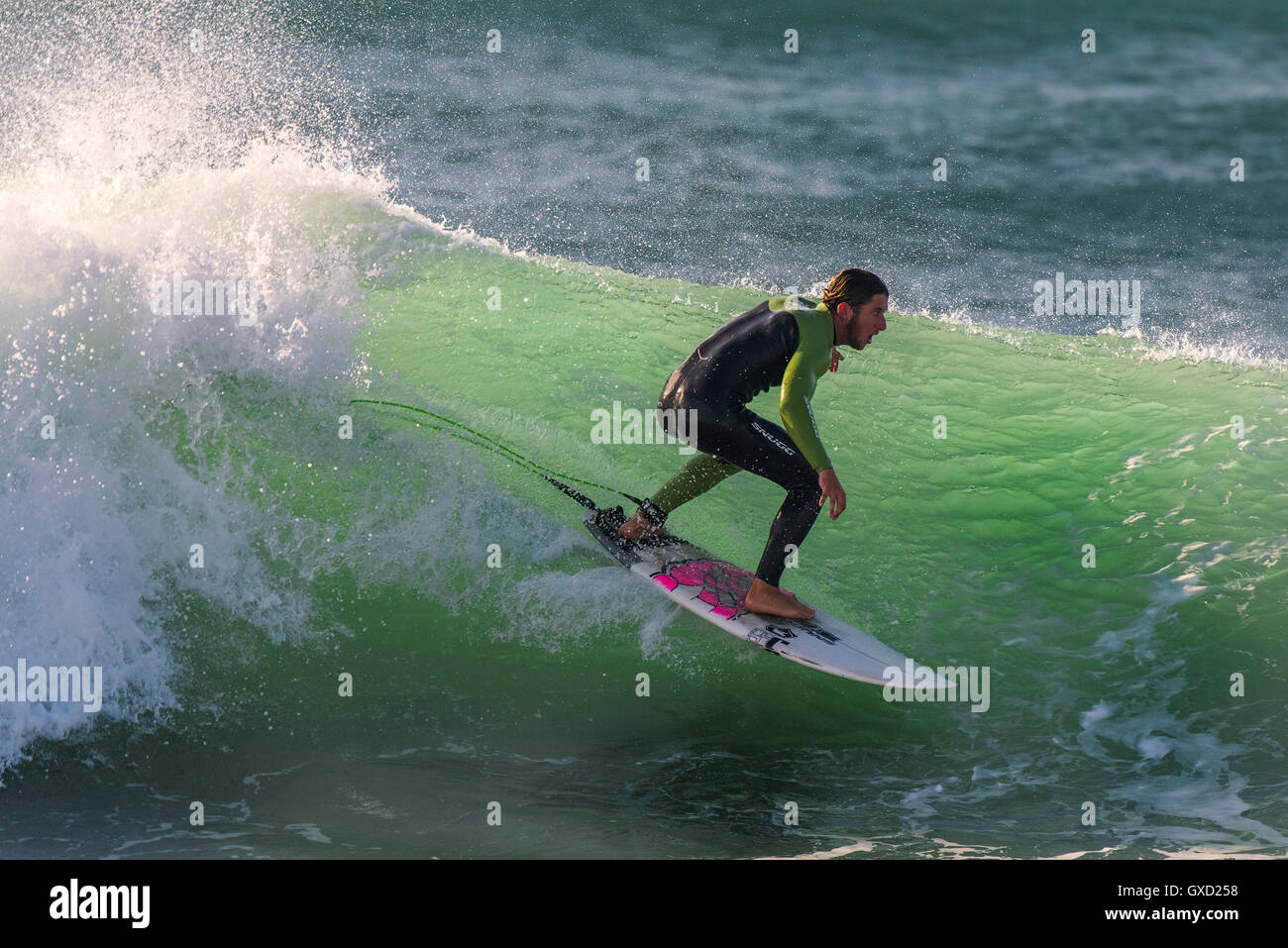 A surfer in spectacular action at Fistral in Newquay, Cornwall, England. Stock Photo