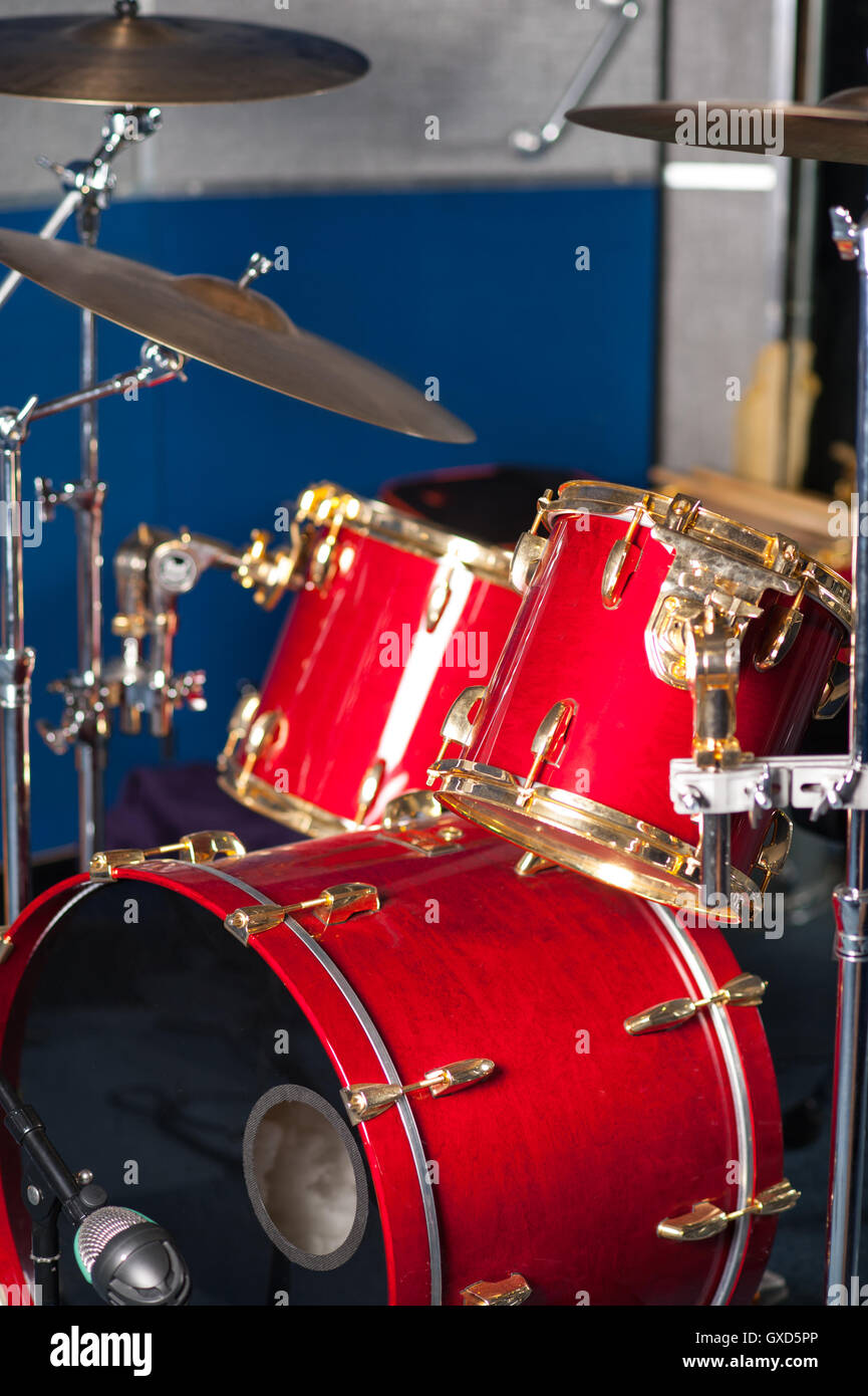 The red drum set inside studio Stock Photo - Alamy