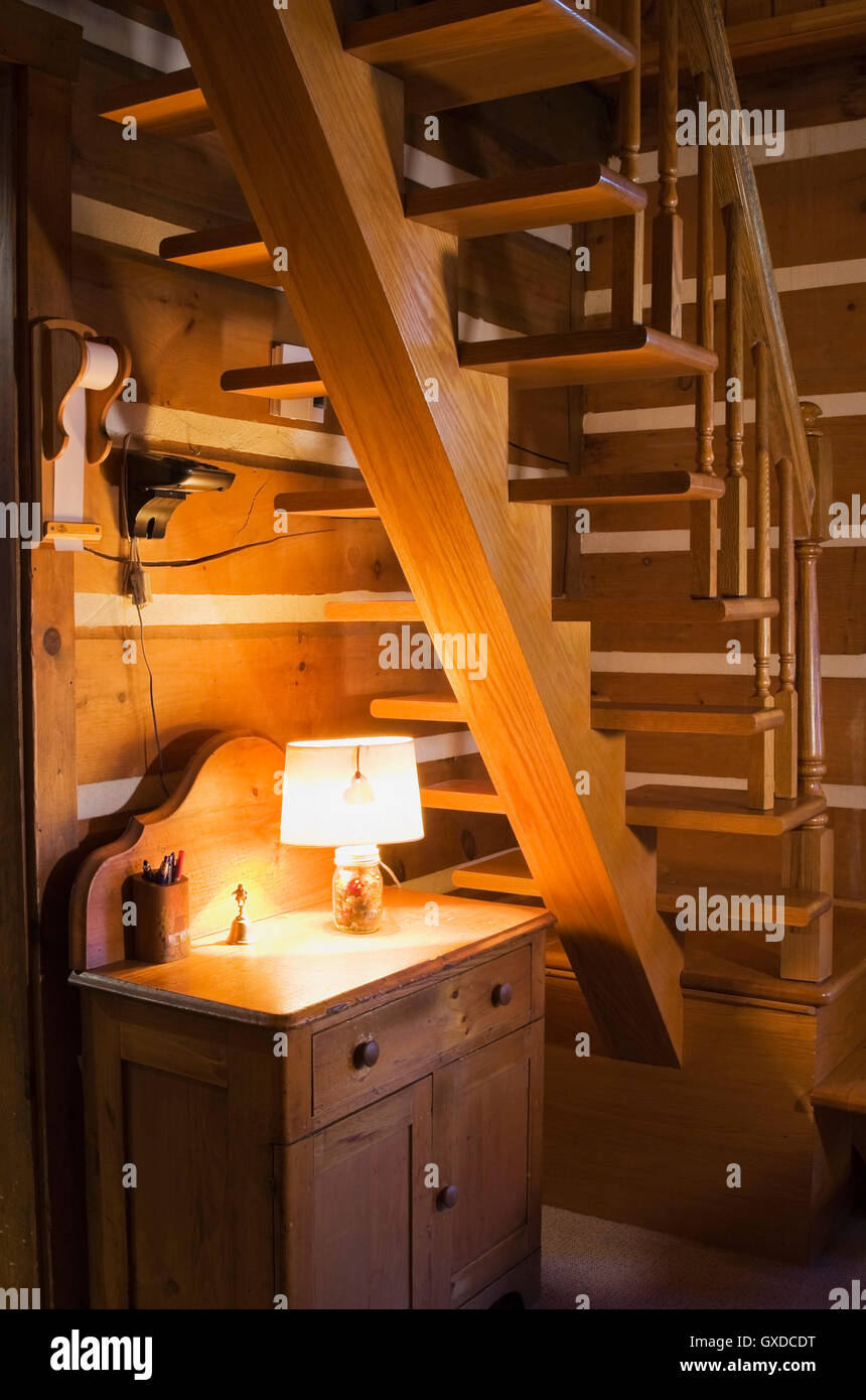 Antique Wooden Cabinet Below Uneven Wooden Stairs In Canadiana