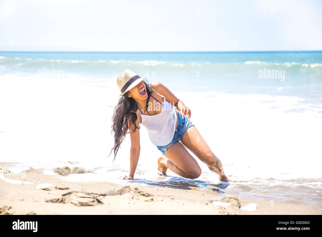 Mid adult woman falling on beach, Malibu, California, USA Stock Photo ...