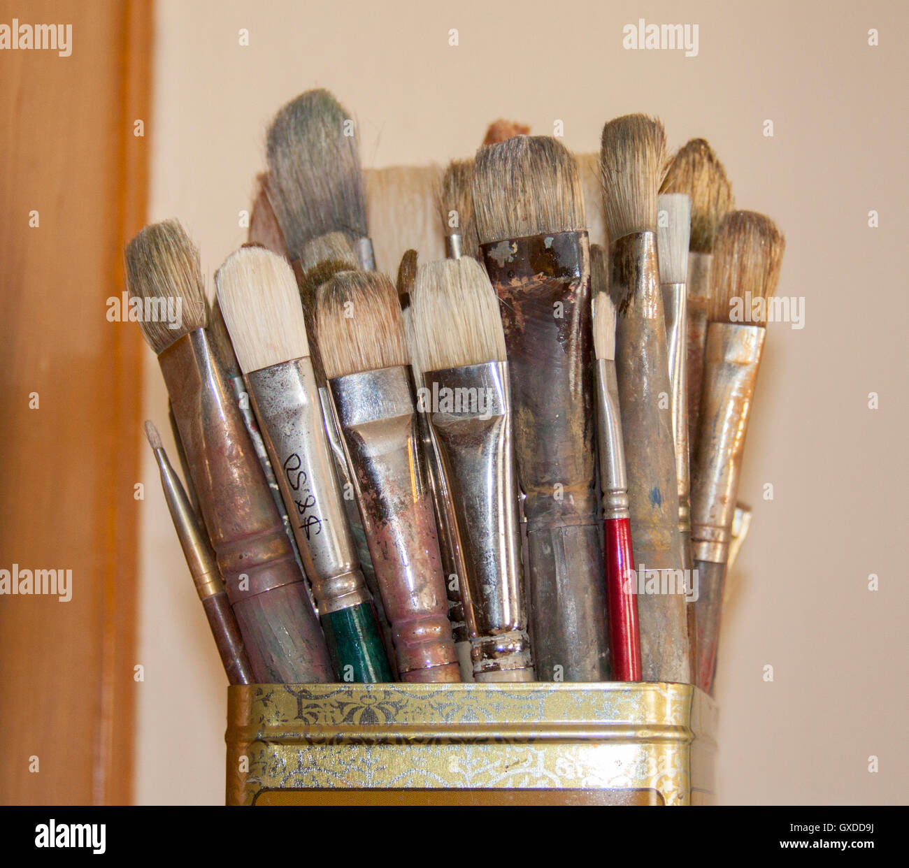 Paintbrushes in tin metal can Stock Photo